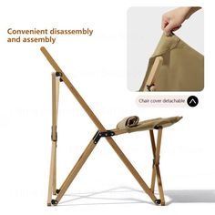 the folding chair is made from wood and has two straps on each side, which are attached