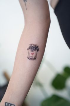 a person with a small tattoo on their arm