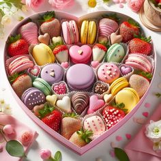 a heart shaped box filled with lots of different types of cookies