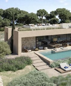 an artist's rendering of a house with a swimming pool and lounge chairs in the foreground