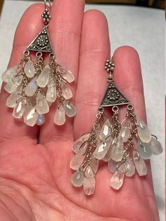 "Vintage Sterling Silver and Briolette MOONSTONE Girandole Chandelier Earrings. They measure 1 3/8\" long x 1 1/8\" wide and weigh 12 grams. Beautiful 10mm faceted briolette Moonstones and four briolette aquamarines. Maker's mark on the back of each floral sterling piece. The second photo was take outdoors in natural light. Excellent condition." Heart Piercing, Maker's Mark, Large Earrings, Oxidized Sterling Silver, Silver Enamel, Pierced Earrings, Earrings Photo, Moon Stone, Pink Tourmaline