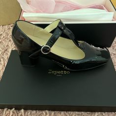 Beautiful Black Patent Leather Mary Jane. New Never Been Worn, With Original Packaging. Bought As A Gift But Were Too Big. Would Fit A 9.5-10. The Box Says 42 But Repetto Runs Small. For Reference, I Am A 8.5 And I Wear A 40. Elegant Black Mary Janes For Formal Occasions, Elegant Black Mary Janes For Office, Elegant Leather Mary Janes With Block Heel, Elegant Mary Janes With Leather Sole And Ankle Strap, Elegant Mary Janes With Ankle Strap And Leather Sole, Elegant Fitted Leather Mary Janes, Classic Black Mary Janes For Formal Occasions, Formal Low Heel Mary Janes With Branded Heel Counter, Evening Mary Janes With Leather Sole And Low Heel