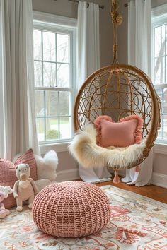 a living room filled with furniture and lots of windows