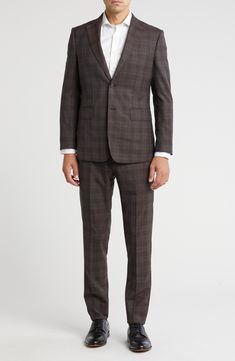 Classic notched lapels smarten the jacket of this trim-fit suit paired with flat-front trousers and finished in a handsome plaid print. 35 1/2" inseam; 10 1/2" rise (size 40R) Jacket has notched lapels; chest welt pocket; front flap pockets Unhemmed Lined 90% wool, 10% polyester Dry clean Imported Tailored Plaid Suit With Notch Lapel, Plaid Suit With Suit Collar For Work, Plaid Notch Lapel Suit For Business Casual, Plaid Single Breasted Suits For Business Casual, Tailored Plaid Suits For Business Casual, Tailored Plaid Suits With Welt Pockets, Plaid Suits With Welt Pockets And Suit Collar, Plaid Suit With Suit Collar For Business Casual, Plaid Suits With Notch Lapel And Welt Pockets