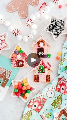 the video shows how to decorate gingerbread houses with candy canes and candies