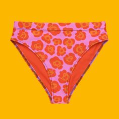 Get ready to make a statement with the Spotted Jaguar Recycled High-Waisted Bikini Bottoms, designed to perfectly complement the matching Spotted Jaguar bikini top. Featuring a bold jaguar-inspired print in vibrant shades of orange and pink, these high-waisted bikini bottoms are as fierce as they are sustainable.Pair them with the matching Spotted Jaguar bikini top or mix and match with other pieces from the Tropical Escape collection for a look that’s uniquely yours. These bottoms are designed Bold High Waist Swimwear For Beach, Bold High Waist Swimwear For The Beach, Bold High-waist Swimwear For Beach, Bold Stretch Bottoms For The Beach, Bold Fitted Beach Bottoms, Bold Fitted Pink Swimwear, Tropical Escape, Orange And Pink, Shades Of Orange