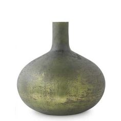 a green vase sitting on top of a white table