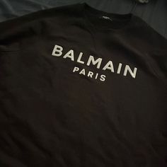 Balmain Sweater Black Xl Luxury Winter Sweatshirt With Letter Print, Luxury Tops With Logo Detail For Fall, Luxury Logo Tops For Fall, Luxury Logo Detail Tops For Fall, Luxury Black Sweatshirt For Streetwear, Luxury Long Sleeve Tops With Logo Detail, Designer Letter Print Sweatshirt For Streetwear, Black Luxury Sweatshirt With Letter Print, Luxury Logo Print Tops For Winter