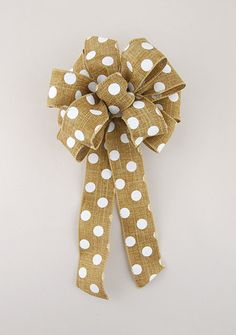 a brown and white polka dot bow