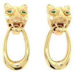 These striking panther motif dangle earclips in 18K yellow gold exude bold sophistication and timeless appeal. Featuring two marquise-shaped emerald accents totaling 0.18 carats as the panther’s piercing eyes, these earrings channel the luxurious and iconic style of Cartier with a touch of individuality. Measuring an impressive 62 millimeters long and weighing 61 grams, these earrings are substantial yet expertly designed for comfortable wear. The intricate detailing of the panther motif reflect Vintage Yellow Dangle Jewelry, Panther Earrings, Elegant Yellow Dangle Clip-on Earrings, Luxury Yellow Clip-on Earrings, Luxury Yellow Gold Vintage Clip-on Earrings, Emerald Eyes, Fine Jewelry Collection, Price Tag, Panther