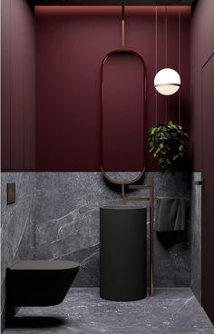 a bathroom with a sink, mirror and plant in it