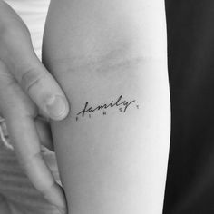 a woman's arm with the word family on it, in cursive font