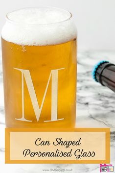 a glass filled with liquid sitting on top of a counter next to a toothbrush