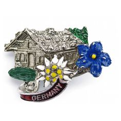 All German hats need a hat pin! This metal hat pin features a German edelweiss flower and alpine haus, with a Germany banner. Made in Germany Approximate Dimensions (Length x Width x Height): 1.5x0.5x1.25" Material Type: Metal German Hat, Oktoberfest Hat, Lederhosen Costume, German Lederhosen, German Hats, Oktoberfest Costume, Edelweiss Flower, Cotton Gloves, Presents For Him