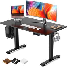 a computer desk with two monitors and headphones next to each other on top of it