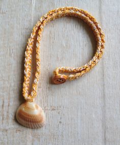 "These sweet shell necklaces are crocheted with mercerized cotton and have a button closure. They are perfect to wear to the beach! The shells were found on my local beach in Jupiter, Florida. Wash by hand with a small amount of liquid soap and lay flat to dry. The necklaces are between 18\" and 19-1/2\" inches in length, the exact measurement of each necklace is indicated in the necklace choice box. The width of the tan/ecru necklace is 3/8\" and the other necklaces are 1/4\" wide. The shells a Adjustable Crochet Necklace For Beach, Adjustable Crochet Necklaces For The Beach, Summer Beach Crochet Jewelry, Summer Crochet Jewelry For Beach, Summer Crochet Beach Jewelry, Bohemian Crochet Necklace For Beach, Bohemian Crochet Necklaces For Beach, Surfer Girl Costume, Mermaid Shell Necklace