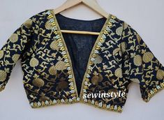 1. Fabric - Brocade.  2. V neck blouse. 3. Elbow Sleeves Blouse. Black V-neck Blouse For Wedding, Festive Wedding Blouse Piece With Yoke Detail, Elegant Wedding Blouse With Yoke Detail, Festive Wedding Blouse With Yoke Detail, Traditional Wedding Blouse With Back Yoke, V Neck Blouse Indian, Black V Neck Blouse, Blouse Sari, Blouse Crop Top