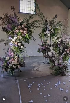 an arrangement of flowers on display in a building