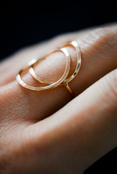 The Eclipse Ring is a new and even bolder version of the Circle Ring! To make the ring, we wrap two lengths of metal into a circular shape and lightly hammer it or leave the smooth, round finish. The hammered effect adds lots of shine and sparkle, so the ring has a big impact overall. We then connect a band around the back for a perfectly customized fit. This ring is incredibly easy to wear and very comfortable! This style is offered in 1.5mm metal an made from 14K Rose Gold Fill. Choose from a Hammered 14k Gold Stackable Rings, Rose Gold 14k Gold Circular Jewelry, Fine Jewelry Rose Gold Rings In Recycled Gold, Elegant Hammered Stackable Rings In Recycled Gold, Rose Gold Recycled Gold Open Ring, Stackable 14k Rose Gold Round Rings, 14k Rose Gold Round Ring, Rose Gold 14k Round Ring, Modern Twist Rose Gold Ring