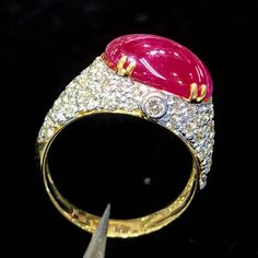 BRAND-NEW!! ONE OF A KIND, HANDCRAFTED RING. EXTREMELY ELEGANT, UNIQUE style, 6.89 carats Certified, GORGEOUS RED RUBY ring. This ring offers an important statement of who you are with a JUMBO 5.35 carats, VIVID RED, TRANSLUCENT CABOCHON, BURMESE RUBY. Accentuating the RUBY are the 60 E/VVS, and sparkling natural diamonds THE ITEM YOU SEE IN THE PICTURES IS THE EXACT ITEM YOU WILL GET! ONE OF A KIND, NO DUPLICATES OR TWINS SUGGESTED RETAIL VALUE: $12,500 RUBY: Weight: 5.35 carats Shape: OVAL Cab Red Ruby Ring, Gold Ring Engagement, Burmese Ruby, Vs Diamond, Yellow Gold Engagement Rings, Handcrafted Rings, Natural Gifts, White Gold Engagement Rings, Ruby Diamond