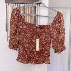 New With Tags. Size Small. Very Stretchy. Pretty Brown Floral Print. Feminine Brown Tops For Spring, Summer Brown Blouse For Brunch, Feminine Brown Blouse For Spring, Brown Feminine Summer Tops, Feminine Brown Summer Tops, Summer Brown Tops With Floral Print, Brown Spring Tops For Brunch, Brown Floral Print Top For Brunch, Fitted Brown Blouse For Spring