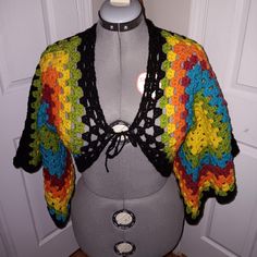 a crocheted top on a mannequin head