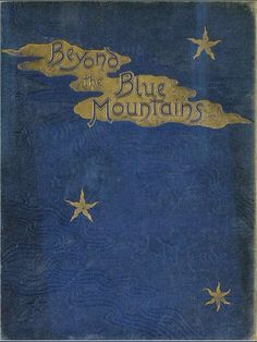 an old blue book with gold lettering and stars on the cover, which reads beyond the blue mountains