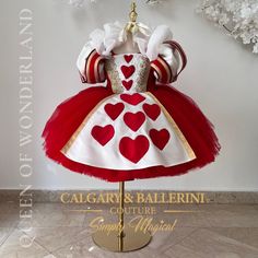 a red and white dress with hearts on it