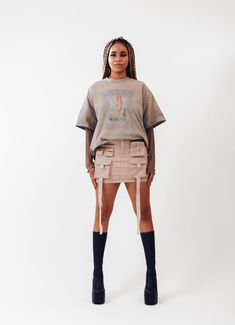 Get ready to amp up your streetwear game with our freshest creation - introducing the ACS Mini Cargo Skirt! We've poured our techwear and streetwear passion into this beauty, and we can't wait for you to experience it firsthand. *Intricate Design, Striking Look: Dive into the dynamic front design, featuring cargo pockets and hanging straps. This combination crafts a unique silhouette that effortlessly catches attention, making each step a statement. *Beige Colorway: Elevate your wardrobe with the versatile light beige hue. It effortlessly complements your existing collection, offering a canvas for endless creative pairings. *Perfect Mini Length: The ACS Mini Cargo Skirt strikes the ideal balance between mini and comfort  *Customized Comfort, Adjustable Waistband: Experience the luxury of a Fitted Mini Skort For Streetwear, Fitted Mini Length Skort For Streetwear, Y2k Fitted Skirt For Streetwear, Edgy Streetwear Skirt With Pockets, Y2k Mini Skirt For Streetwear, Edgy Streetwear Mini Skirt With Pockets, Edgy Mini Skirt With Pockets For Streetwear, Fitted Y2k Skirt For Streetwear, Streetwear Bottoms With Pockets In Mini Length