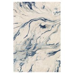 a white and blue area rug with an abstract design on the bottom, in front of a white background