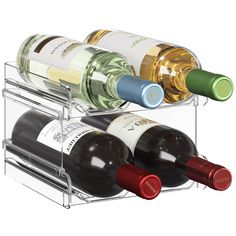 three bottles of wine are sitting in a rack