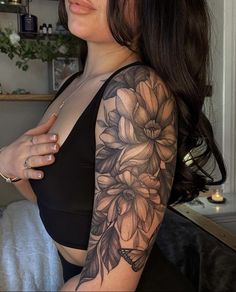 a woman with a tattoo on her arm