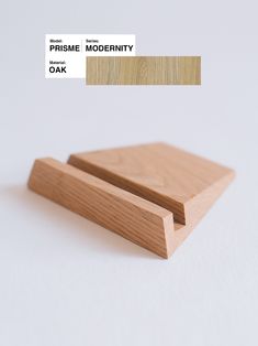 two pieces of wood sitting next to each other on top of a white surface with the words prisme modernity oak