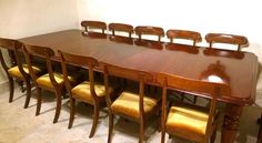 a large wooden table with six chairs around it