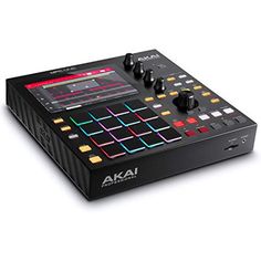 the akai professional dj controller is black and has multicolored lights on it