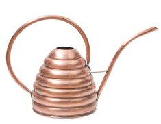 a copper colored tea pot with a long metal handle and a curved design on the top