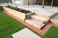 an outdoor garden area with steps and grass