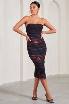 Meet My Girl, a captivating midi dress designed to contour your unique curves. Crafted in our signature stretch jersey and wrapped in a layer of ruched mesh, the plum bodycon features a strapless bandeau bodice and a split to the rear of a calf-length skirt. Pair this midi dress with warm gold accents for an effortless birthday or date night outfit. Features - Premium stretch jersey and mesh- Fully ruched- Bodycon fit - Strapless bandeau neckline- Invisible zip closure - Split hemline - Midi length Sizing & Fit Model is 5'8.5" and wears UK size 8 / US size 4 Product Information Designed exclusively by Club L London Double layered with excellent stretch Premium jersey & mesh in Plum Print (95% Polyester, 5% Elastane) 120cm total length SKU: CL129493162 Midi Bridesmaid Dress, Mesh Midi Dress, Calf Length Skirts, Designer Midi Dresses, Black Dress Prom, Strapless Bandeau, Girl A, Black Velvet Dress, Invisible Zip