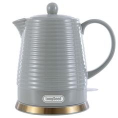 a gray and gold coffee pot with the words long - seed on it's side