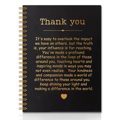 a note book with the words thank you written in gold foil on black paper and an image of a heart