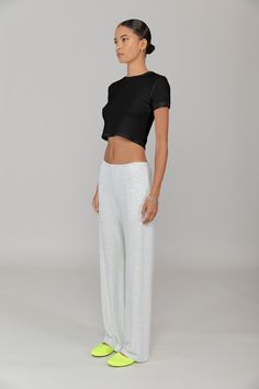 Cut in our stretch cotton rib, The Kelly Crop Slim Fit Tee is a modern classic. Featuring a classic crew neckline and cropped length, this is the perfect pair for a high waisted pant. Casual Stretch Bottoms With Cropped Hem, Basic Crop Top For Loungewear, Versatile Relaxed Fit Crop Top For Loungewear, Versatile Cropped Bottoms For Loungewear, Versatile Stretch Cropped Pants, Versatile Cropped Relaxed Fit Pants, Versatile Cropped Pants With Relaxed Fit, Stretch Cropped Bottoms For Loungewear, Fitted Crop Top With Cropped Hem For Loungewear