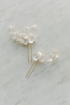 "bridal hair pins, floral hair pins set, wedding blossoms headpiece with a cluster of hand formed clay flowers with pearls effect. flowers are hand wired and have a peals like color, daintily attached to metal hair pins. Delicate, exquisite and very feminine, this headpiece is absolutely beautiful, and evoke spring, elegance... CÂLIN hair pins are for the modern bride in need of the small touch of Elegance and sophistication SPECIFICS set of 2 pins is Approx 2 1/2\" and 3 1/2\" at the widest cla Simple Bridal Hair Accessories, Real Flowers Bridal Hair, Floral Hair Clip Wedding, Flowers Bridal Hair, Flowers With Pearls, Bridal Hair Clips, Bridal Hair Flower, Bridal Hair Down, Bridal Hair Pins Pearl