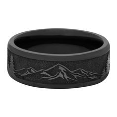 a black wedding band with mountains on it