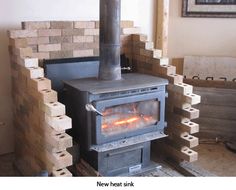 a wood burning stove sitting inside of a room