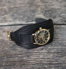 Leather watch band for men. Suitable for watches with lug widths 18mm, 20mm, 22mm, 24mm. The strap is matte black. Made in full grain Badalassi leather bund band. Bund strap military, medium soft, dense, durable, multifunctional, comfortable, pleasant to the touch looks beautiful on a man's hand. Handmade cuff watch strap is a good last minute gift for men.  Bund band design Watch strap with cuff. The two piece watch band is made of one layers of leather, flat, unlined. The cuff is removable is Vintage Black Watch Accessories With Leather Strap, Formal Black Adjustable Watch Bands, Black Leather Cuff Watch Bands, Black Cuff Bracelet Strap Watch Accessories, Black Cuff Bracelet Watch Band, Vintage Black Adjustable Watch Bands, Adjustable Black Cuff Watch Accessories, Handmade Black Watch As A Gift, Handmade Black Watches As Gifts