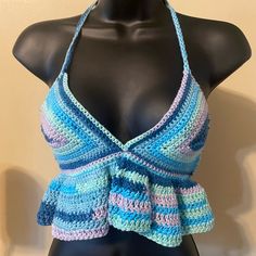 a crocheted halter top on a mannequin