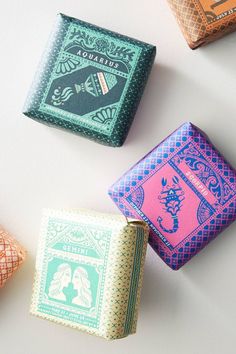 four different colored playing cards laying on top of each other