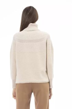 Elevate your wardrobe with this luxurious turtleneck sweater by Alpha Studio. Perfect for those who covet a blend of comfort and style, it’s crafted with a rich fabric mix featuring wool, cashmere, and alpaca leather. Its exquisite beige hue makes it a versatile piece for any ensemble, while the fine ribbed cuffs and bottom add a touch of refined texture. Made with care in Italy, this sweater is a testament to your impeccable taste. Material: 16% Wool, 12% Viscose, 24% Polyamide, 4% Cashmere, 24 Beige Turtleneck, Haute Couture Brands, Rich Fabric, Mixing Fabrics, Clothes Collection, Wool Fabric, Look Chic, Wool Sweater, Leather Accessories