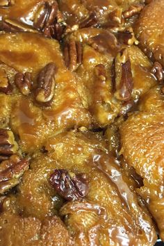 pecan bread with caramel sauce and pecans in the middle on a plate