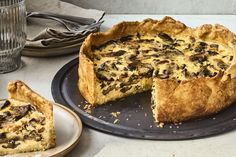 there is a pie on the table with one slice cut out and another half eaten